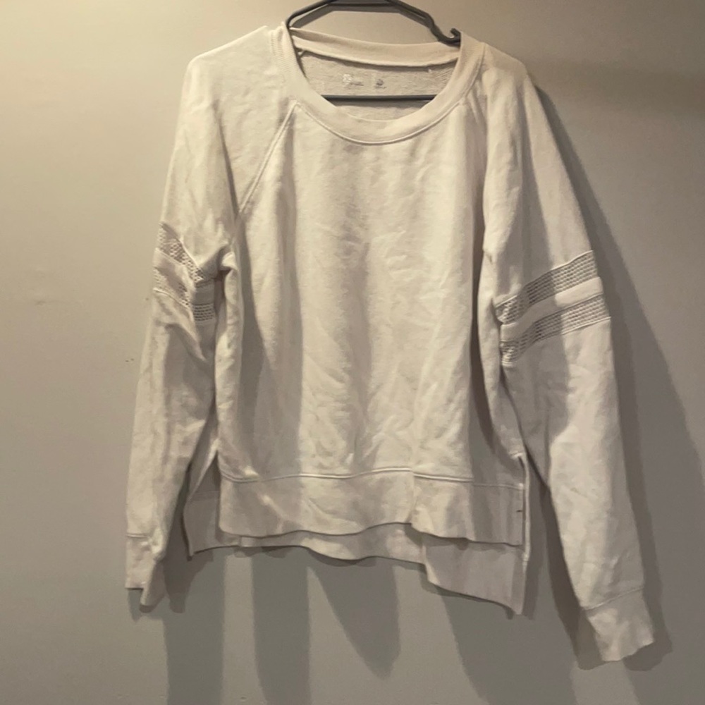 white athletic sweater